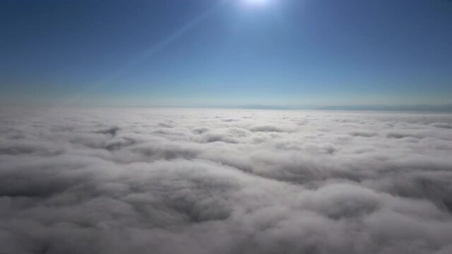 Flying in the clouds flying in the clouds. The clouds are moving on camera. Flying through the cloud
