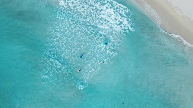 Surfing in blue sea at smith beach, Dunsborough, South West, Western Australia