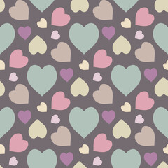 Seamless pattern with hearts in pastel colors on gray background. Vector image.