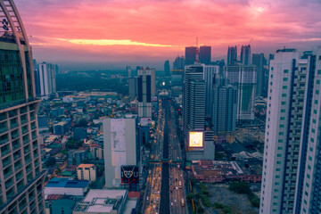 Naklejka na ściany i meble Dramatic sunset of Manila city in capital Philippines.