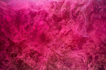 Fototapeta premium Pink smoke on black ink background, colorful fog, abstract swirling touch ocean sea, acrylic paint pigment underwater