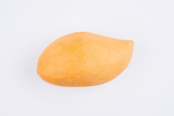 Whole orange thai mango isolated on white background, clipping path