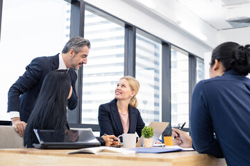 Business people discussing with ideas at meeting.