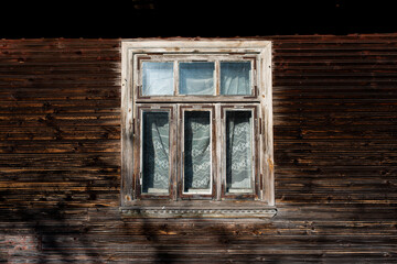 An old window in an old wooden house in Podlasie, Poland 