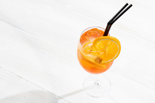 cocktail aperol spritz on a white background. traditional Italian alkoholic refreshing drink