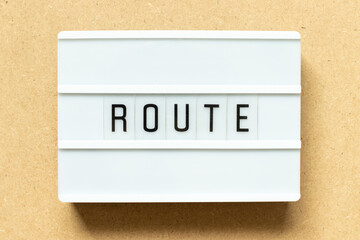 Lightbox with word route on wood background