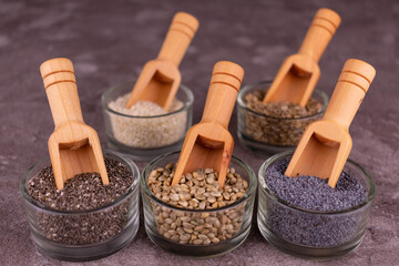 An assortment of healthy sesame seeds, chia seeds, dill, poppy seeds, hemp seeds.	
