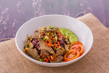 Stir fried salt and pepper pork liver with rice berry