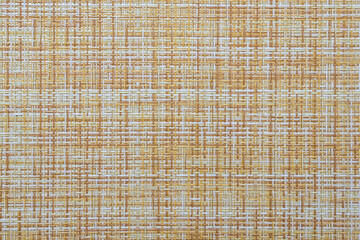 The texture of a kitchen table napkin. The tablecloth is woven.