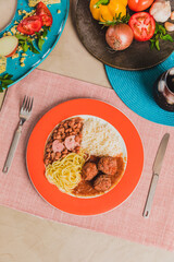 Delicious Homemade Classic Food Brazilian Dish Plate Menu Lunch Breakfast Rice Beans Pasta Sausage Shrimp on the Table