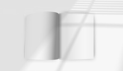 White opened book mockup with sun flare effect. Light of the window with blinds