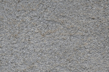 Gray stucco textured wall background with natural light.