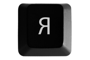Black keyboard button with Russian letter Я on white isolated background
