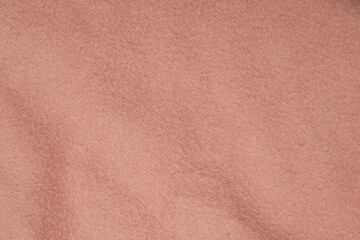 Texture of soft pink fleecy fabric.