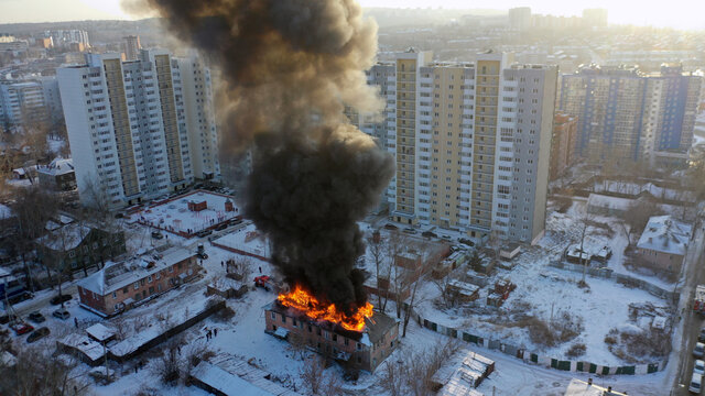 Fire in the house. An apartment building in Irkutsk is on fire. A flame of fire engulfed the building.