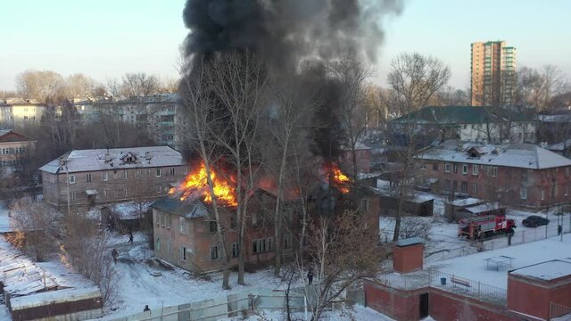 Fire in the house. An apartment building in Irkutsk is on fire. A flame of fire engulfed the building.