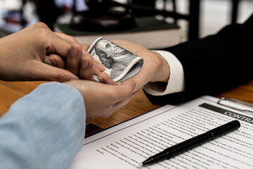 Second hand images of people putting dollars in their hands, they are business partners who are...