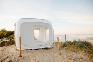Take away sleeping capsule. Sleeping capsule on the beach by the North Sea. Sleeping in a tent on...