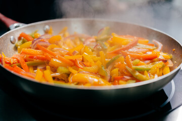 Close up photo of frying colorful vegatables, cooking concept