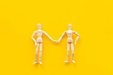 Personal communication concept. Two wooden mannequin figures connection