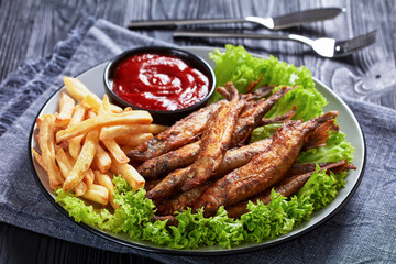 crispy fried capelin with lettuce, french fries