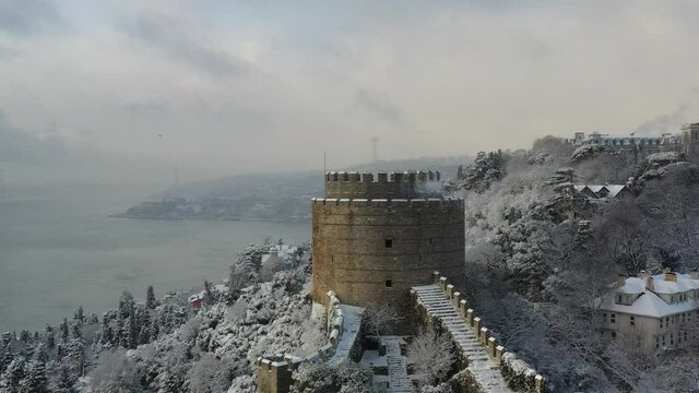 Aerial view of Rumeli Hisari, an ancient fortress with panoramic view along the Marmara Sea with Patih Sultan Mehmet Koprusu bridge in background, Istanbul, Turkey.
