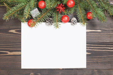 Fototapeta na wymiar Christmas card with envelope and pine branches.Snow drawn.
