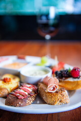 Traditional Spanish tapas on wooden table. Spanish tapas