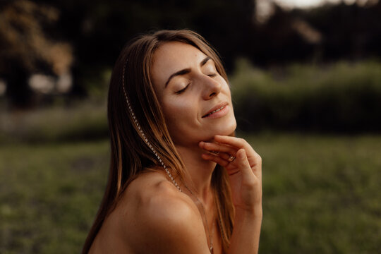 Woman gets pleasure from herself and from summer. Natural beauty