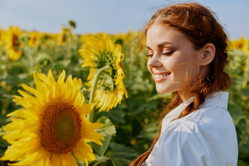 smiling woman in sunflower field nature sun agriculture