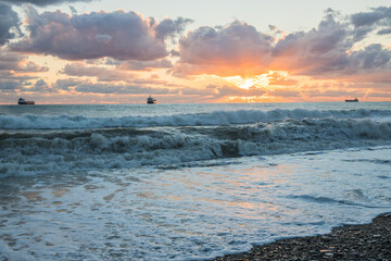 Obraz premium Sunset over the sea coast