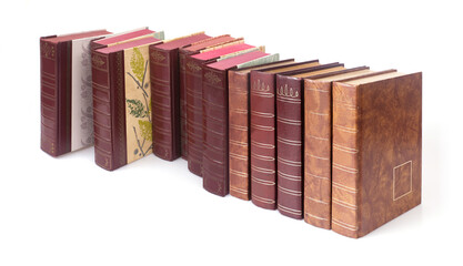 Obraz premium Stack of books in colour covers isolated on a white background