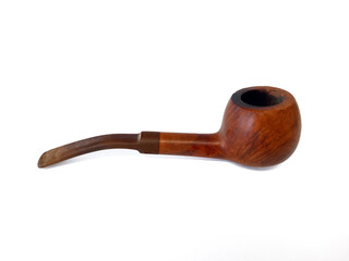 Close up of smoking pipe on wood. Ergonomically designed tobacco pipe isolated on white background. Accessory for smokers. Accessory tobacco.
