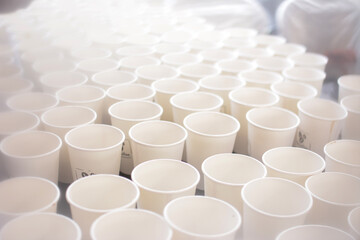 Group of white cups in bar cafe. empty cup. close up of group of white cups or coffee cups piled repeatedly on table preparing hot drinks for corporate events at tea time.