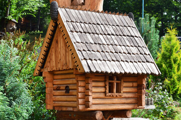 Wooden miniature house. Wooden hut for birds or small animals.