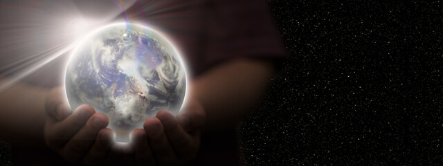 Kid hand hold earth planet globe for environment care protection or save the world (Elements of this Image Furnished by NASA)