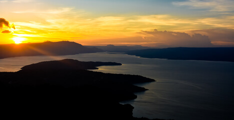Fototapeta premium The beauty of Lake Toba which is a caldera lake comes from an ancient volcanic eruption and is the largest volcanic lake in the world. View from geosite hutaginjang. North Sumatra, Indonesia