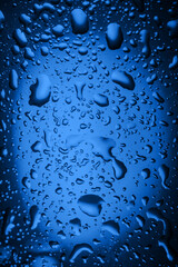 close up. drops of water on a glass of water
