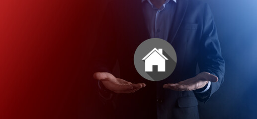 Real estate concept, businessman holding a house icon.House on Hand.Property insurance and security concept. Protecting gesture of man and symbol of house.flat icons with long shadows
