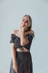 beautiful blonde woman in a gray dress