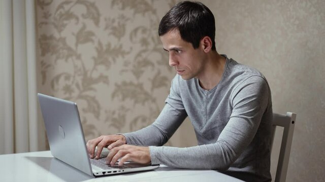 Man typing fast on the keyboard