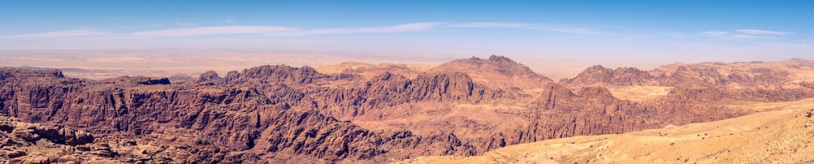 Naklejka na ściany i meble Panorama of Jordan Desert and moutain area surrounding Wadi Musa and historical site of Petra