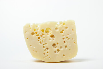 Cheese isolated on a white background. Fresh cheese with holes.