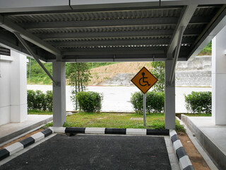 KUALA LUMPUR, MALAYSIA -JANUARY 24, 2021: Signage for disabled parking. Erected with poles for easy viewing. Shown in the form of a logo for everyone to understand.
