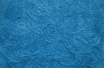 Embroidery on blue linen, design element