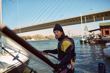 Windsurfer surfing on a windy day at the river.