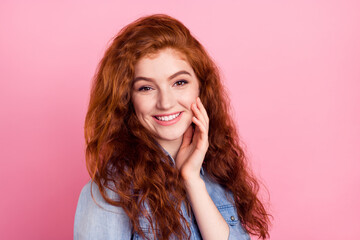 Photo of sweet shiny young lady dressed jeans shirt arm cheek smiling isolated pink color background