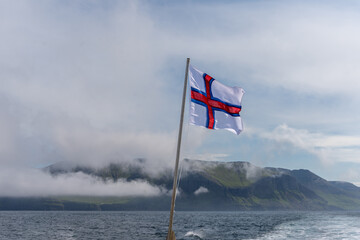 The Faroe Islands Flag, with its White and cross Red a blue stripes 