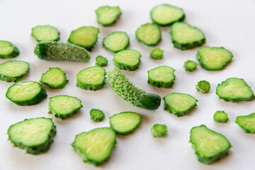 Sliced and whole small cucumbers.