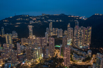 Fototapeta na wymiar Aerial shot a Hong Kong cityscape with skyscapers at night time.